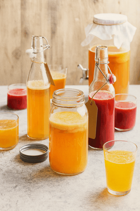 Homemade kombucha in jars and bottles, ready for drinking