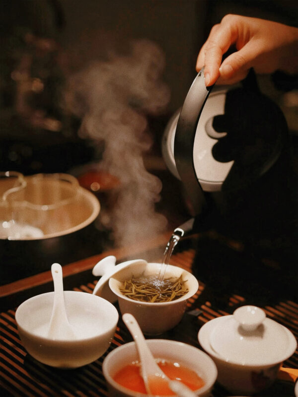 Brewing Dahongpao oolong tea with a gentle approach, focusing on patience, balance, and avoiding bitterness