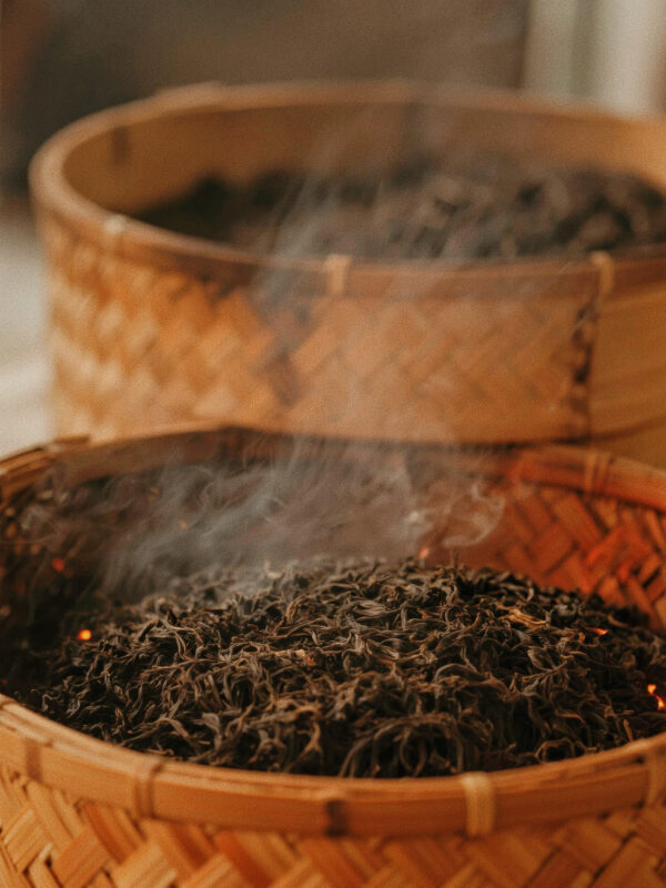 Traditional roasting process of Dahongpao oolong tea, where careful heat brings balance rather than smoky intensity