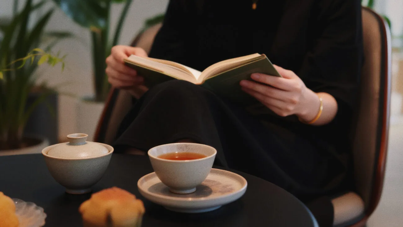 A quiet moment of drinking Chinese tea after a meal, creating a simple daily ritual of comfort and ease.