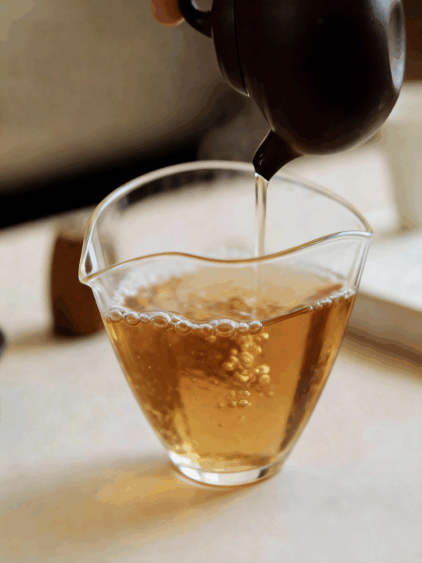 Warm tea in motion, evoking aroma, internal flow, and a gentle sensory journey through the body.