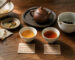 Two cups of Chinese tea after a meal, showing a lighter brew and a stronger brew with different tea-to-water ratios