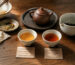 Two cups of Chinese tea after a meal, showing a lighter brew and a stronger brew with different tea-to-water ratios