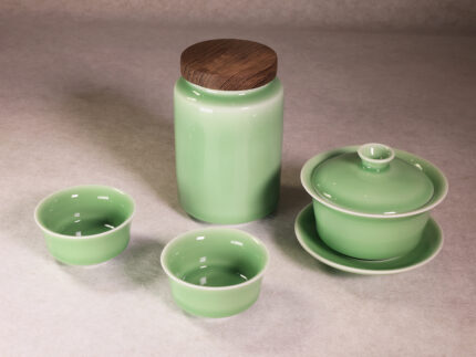 Longquan celadon tea set with gaiwan, tea cups and tea can in plum green glaze