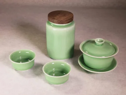 Longquan celadon tea set with gaiwan, tea cups and tea can in plum green glaze