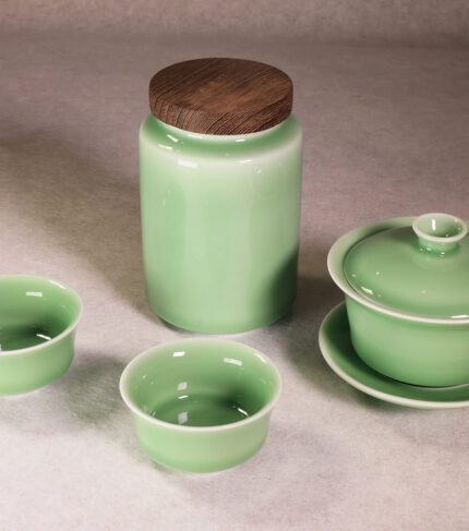 Longquan celadon tea set with gaiwan, tea cups and tea can in plum green glaze