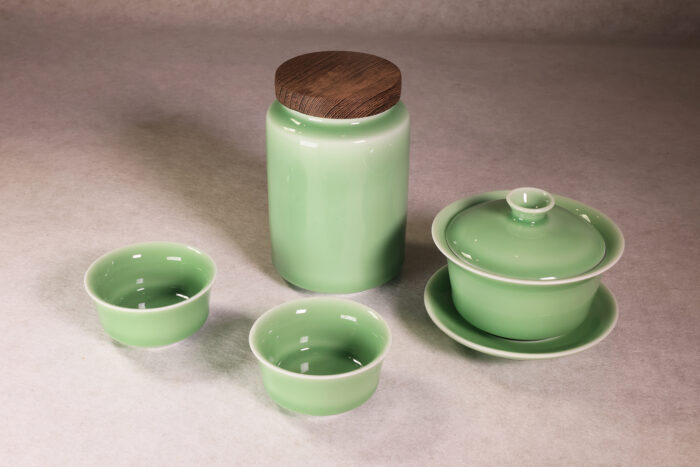 Longquan celadon tea set with gaiwan, tea cups and tea can in plum green glaze