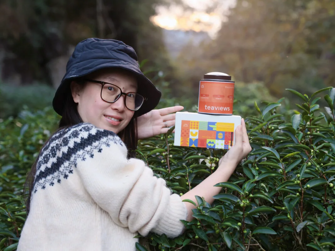 Teaviews founder holding a Chinese tea product, sharing the brand’s everyday approach to tea.