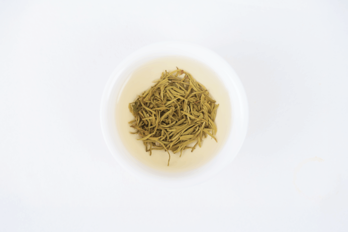 Infused leaves of Hengxian Jasmine Tea after brewing in a white bowl.