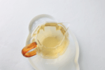 Pale yellow-green Hengxian Jasmine Tea liquor in a glass serving pitcher.