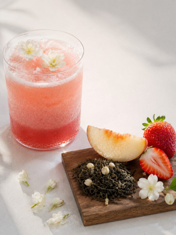 Pink jasmine fruit tea with peach, strawberry, jasmine flowers, and loose leaf tea