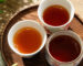 Comparison of Wuyi rock tea liquor colors across light roast, medium roast, and traditional roast Yancha.