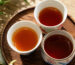 Comparison of Wuyi rock tea liquor colors across light roast, medium roast, and traditional roast Yancha.