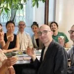 Ling Chen sharing Chinese tea with guests at a tea gathering in Milan.