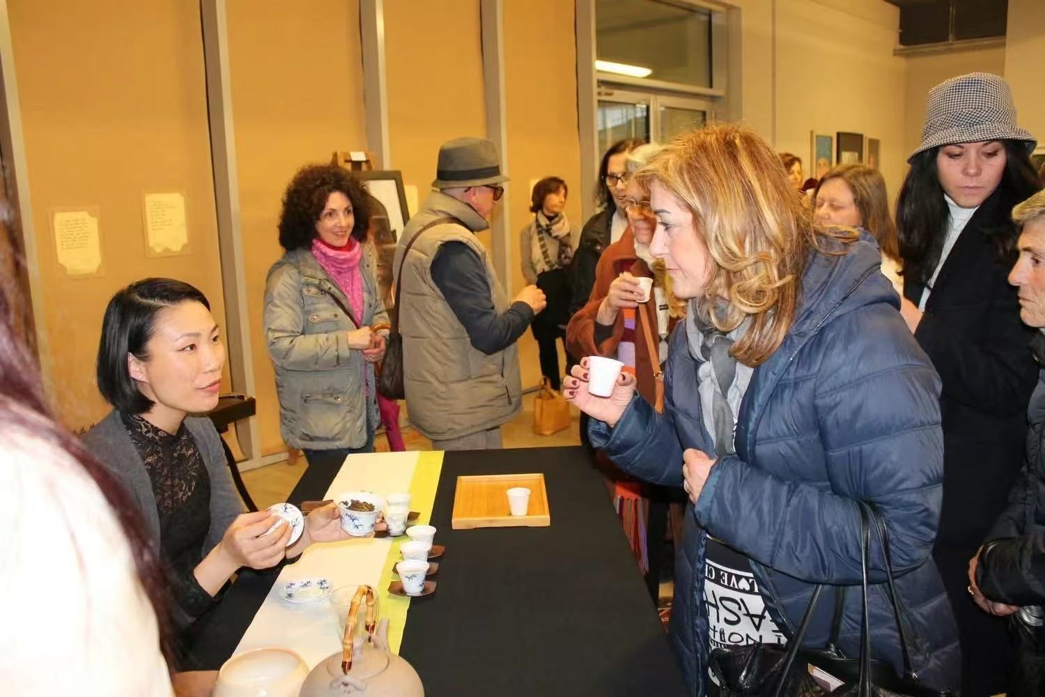 Ling Chen serving tea at an event in Milan the day before her daughter was born